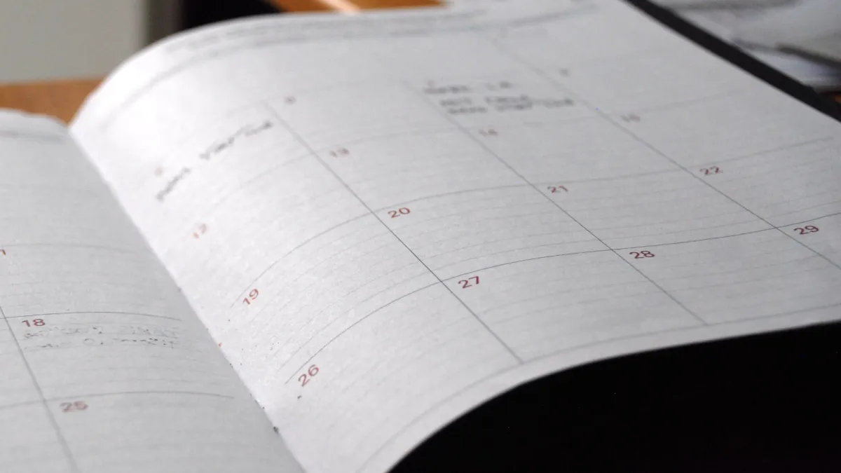 An open monthly planner on a desk